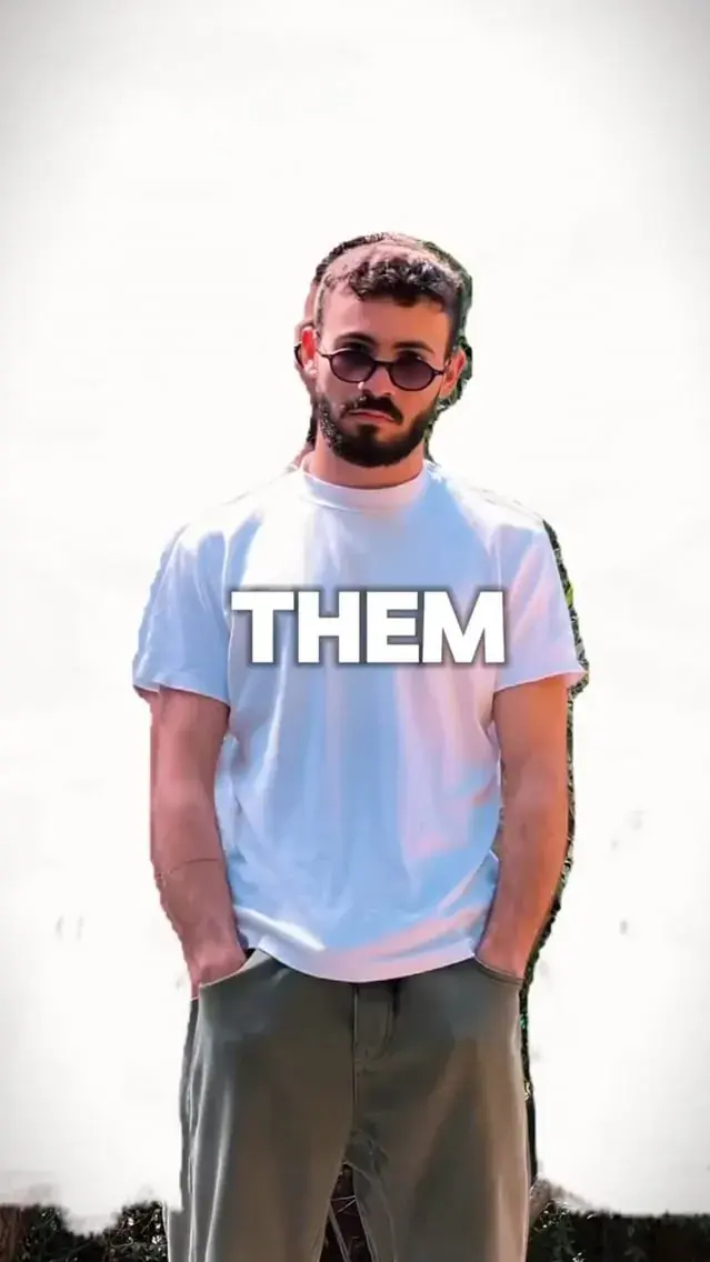 Kevo Emerezian standing against a white wall, from his showreel